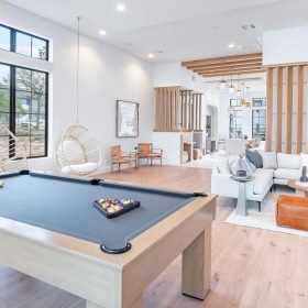 State-of-the-art amenities Spacious room with pool table at Citizen House East Lake apartments in Austin, TX