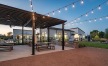 outdoor grills and picnic area with stringed lighting
